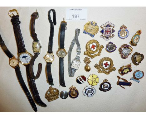 Vintage wrist watches and enamel badges, some military