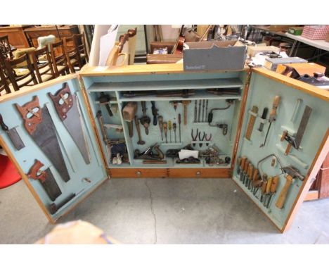 Mid 20th century Wooden Hanging Tool Cabinet filled with old tools including Boxwood Handled Chiesels, Wood Planes, etc