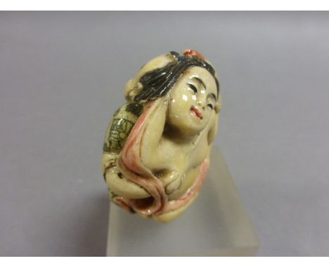 Erotic Double sided Netsuke of a Buddha to one side and Topless Geisha Girl with fan to other