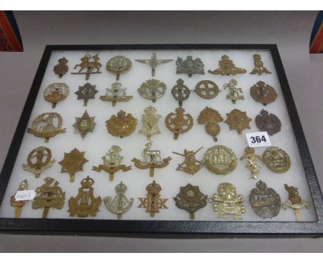 Case of 40  World War I and World War II British Army Cap Badges to include Tank Corps and Parachute Regiment