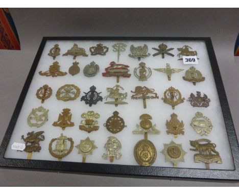 Case of 35 World War I and World War II British Army Cap Badges including No.2 Commando and Machine Gun Corps