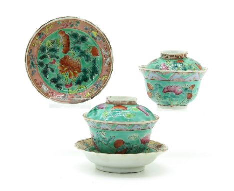 Light green ground with Famille Rose enamels depicting flowers, Qing Dynasty, saucers are 9 cm. in diameter.