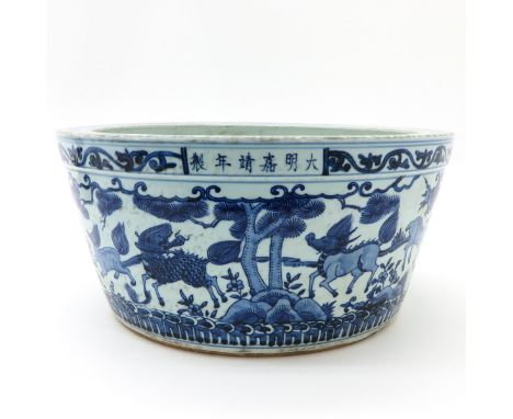Depicting mythological creatures, marked Jiajing in 6 Chinese characters accross planter, 45 cm. in diameter.