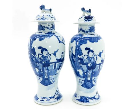Depicting gathering of Chinese woman with boys playing in garden, covers depitcting temple lions, 38 cm. tall, chip on cover.