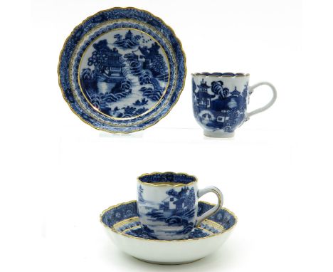 Landscape decor in blue and white with gilt trim, saucers are 12 cm. in diameter.
