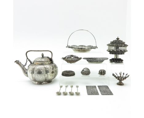 Including teapot, covered jar, platter with handle and other diverse items, teapot is 18 cm. tall. including possible silver.