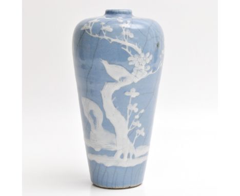Light blue glaze ground with raised decor of bird in tree, marked with seal mark on bottom, 23 cm. tall.
