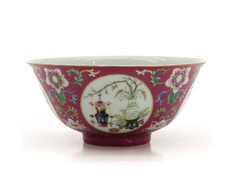 Ruby ground with sgraffito technique, 4 scenes depicting vases and Chinese valuables, marked Daoguang, 15 cm. in diameter.