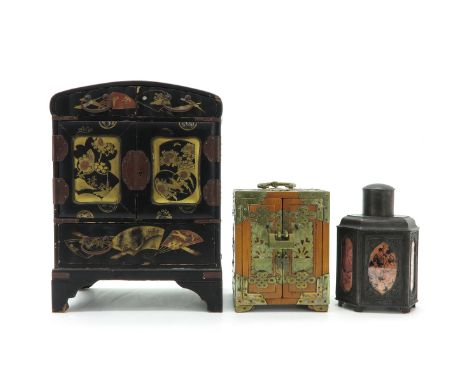 Including 2 jewelry boxes and a tea caddy, largest jewelry box measures 24 x 33 x 13 cm.