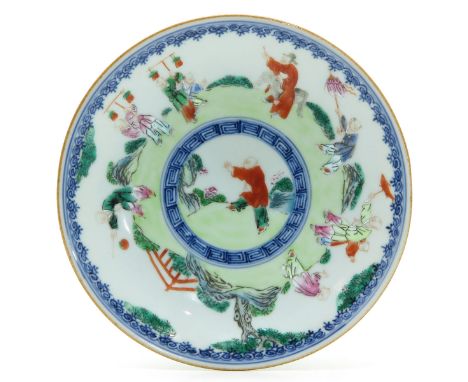 Depicting children playing in garden, marked Qianlong, 15 cm. in diameter.