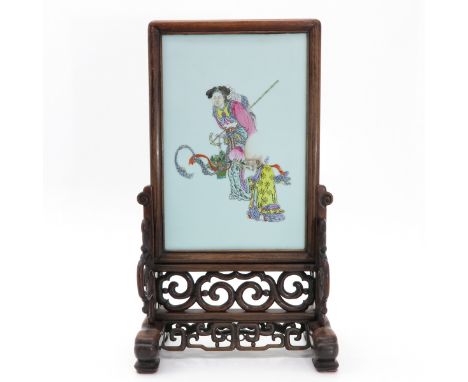 Depicting Chinese woman carrying basket and Chinese man holding fruit, in carved wood stand, tile measures 25 x 38 cm. withou