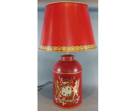 A Toleware table lamp, with gilded decoration on a red ground, complete with Toleware shade, 71cms tall 