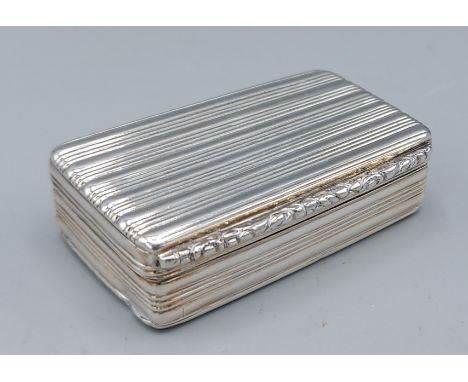 A George IV silver snuff box of ribbed form, with silver gilt interior, Birmingham 1830, maker Edward Smith, 2ozs, 6cms long 