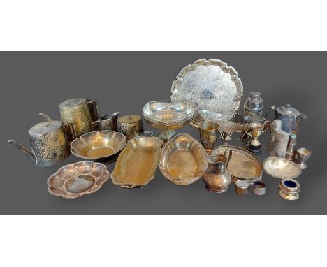 A collection of silver plated items to include a three piece tea service and flatware 