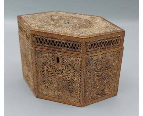 A George III rolled paper tea caddy of hexagonal form, 17.5cms wide, 9.5cms deep and 12cms tall 