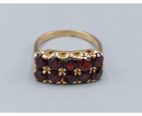 A 9ct gold ring set with two rows of five Garnets, 4.4gms, ring size M 