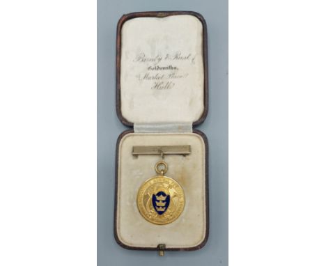 A 9ct gold and enamel decorated medallion, The Music Festival Society, 11.1gms 
