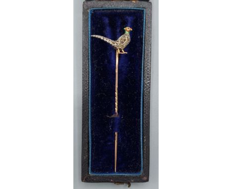 A Victorian yellow metal stick pin set with a Diamond, Ruby and enamel model of a Pheasant, 7cms long 