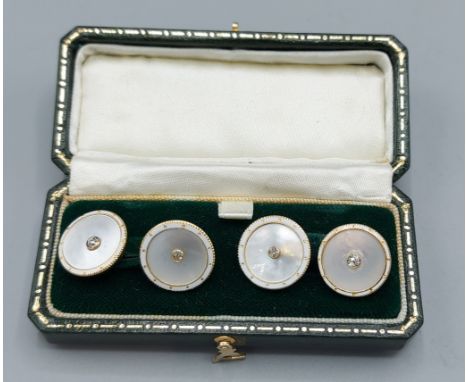 A pair of 18ct gold, enamel, M.O.P. and Diamond set cufflinks 