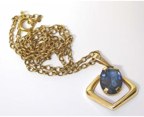 Blue glass single stone set 9ct gold pendant and chain Condition reports are not available for our Interiors Sale.