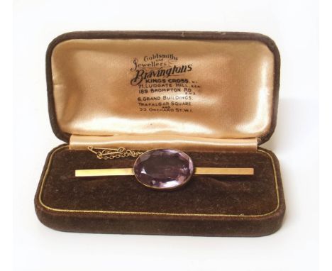 Amethyst and yellow metal bar brooch, amethyst measuring approx. 22mm x 16mm length of brooch 67mm Condition reports are not 