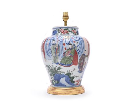 A Chinese Wucai vase, Shunzhi (1644-1661), the vase of ovoid form decorated with a continuous scene of officials and ladies i