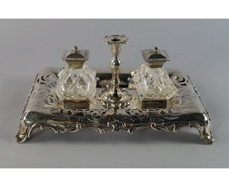 A Victorian silver ink stand, Sheffield 1846, Henry Wilkinson & Co,
of oblong form, with pierced and engraved foliate decorat