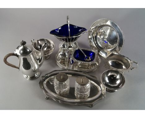 An Edward VII silver and cut glass desk inkwell, Sheffield 1904, Atkin Brothers, of oval form, with shaped border, raised on 