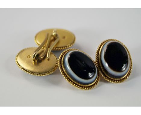 A pair of 18ct gold and agate set gentleman's cufflinks, of oval form, the mount with rope twist border, approx 22cm, approx 