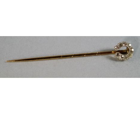 An old cut diamond set stick pin, in the form of a horseshoe, cased. CONDITION REPORT: Good condition.