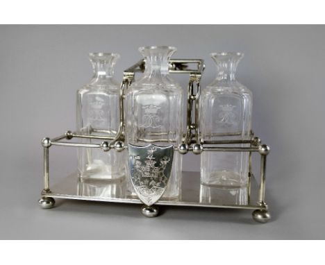 A late Victorian silver six division swing handle decanter frame, Sheffield 1891, Henry Wilkinson & Co, entwined DC initials 