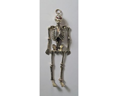 An unusual silver novelty model of a human skeleton, Birmingham 1912, S. Blanckensee & Sons Ltd, with ruby set eyes and diamo