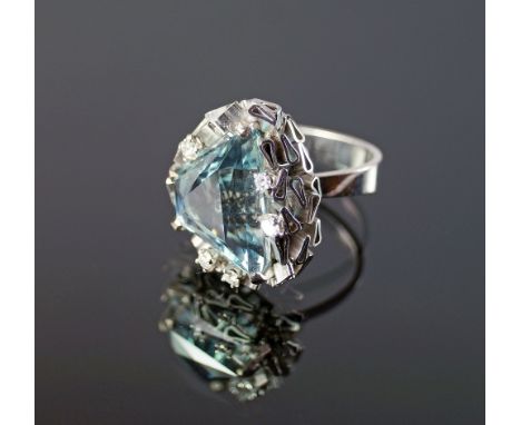 An impressive 18ct white gold, aquamarine and diamond set ring, London 1975, the mount formed of abstract flattened tubes, se