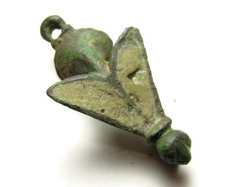 Roman Fly Brooch.  Circa 2nd century AD. Size: 31.46 mm. A copper-alloy trumpet-headed fly brooch. The body of the brooch is 