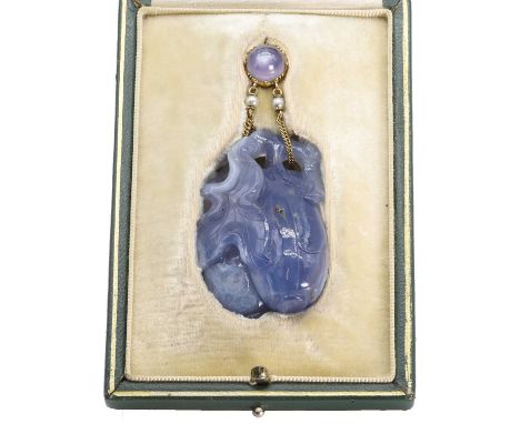 A carved chalcedony and star sapphire pendant, by Carlo and Arthur Giuliano, 1895-1914,  formed by a 19th century carved blue
