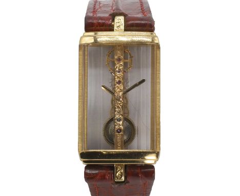 A ladies' 18ct gold Corum Golden Bridge bracelet watch, c.1990's,  ref.1315056, the rectangular case with faceted sapphire gl