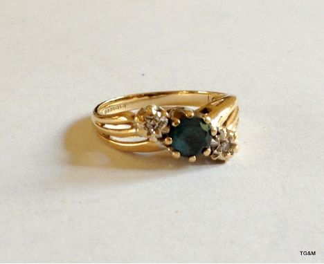 A 9ct gold Aquamarine and diamond ring size K