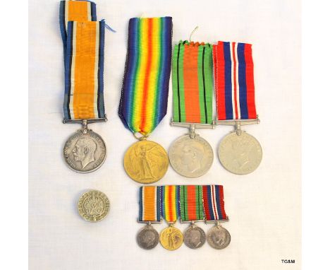 A WW1 & WW2 medal group with mounted miniatures and a WW2 Loyal Service badge. The WW1 pair are named to T4-092577 Driver R G