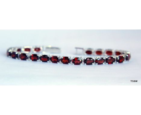 A Silver And Garnet Line Bracelet