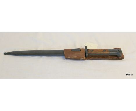 A Czech Mauser Model 1924 bayonet in its steel scabbard and leather frog. The bayonet having almost 100% original bluing with