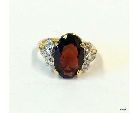 An 18ct white gold ring set with Approx 4ct garnet & diamonds, size K