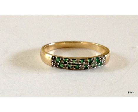 A 9ct gold emerald and diamond ring hallmarked size P