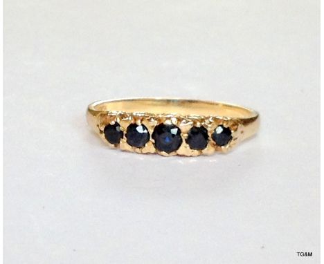 A 9ct gold hallmarked 5 stone sapphire ring size U