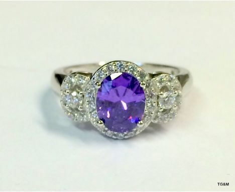 A Silver Cz And Amethyst Ring