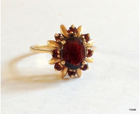 A 9ct gold garnet ring size M