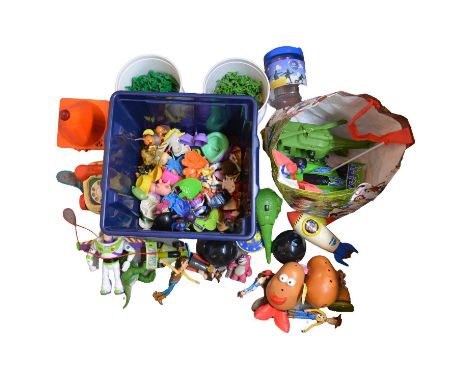 A collection of Toy Story figures and toys, including RC car, with remote control wheel, Mr and Mrs Potato head with accessor