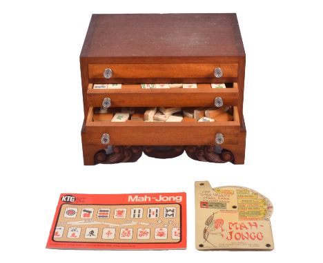 A Mahjong set, in wooden case, one-hundred and forty-eight tiles including eight blanks, with Chad Valley instructions and KT