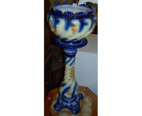 An early 20th century crackle glazed floral decorated ceramic jardiniere on stand, heightened in gilt, with damages, overall 