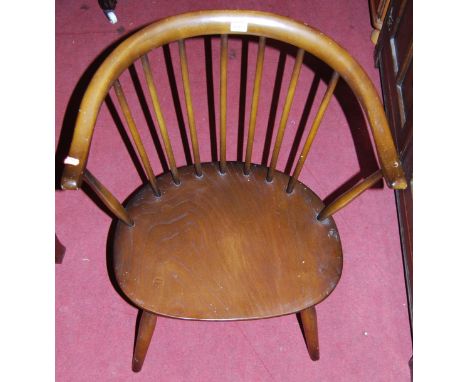 An Ercol dark elm stick back tub chair, together with a mahogany splatback panelled seat single dining chair (2)