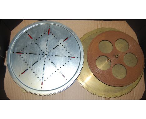 A Meccano geared roller bearing, and two various similar brass Meccano style cogs